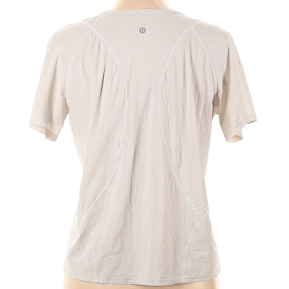 Used Lululemon Active T Shirt. Ivory/White. Size 12.